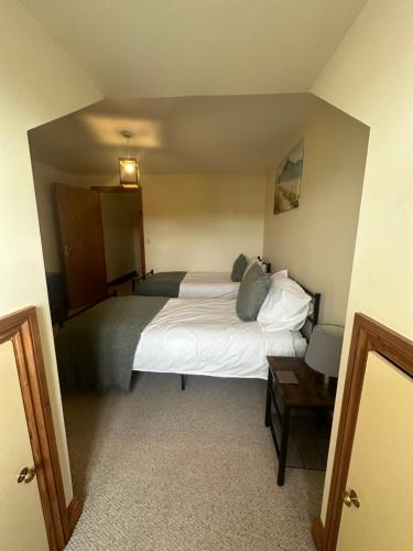 a bedroom with a large bed in a room at Riverside in Brecon