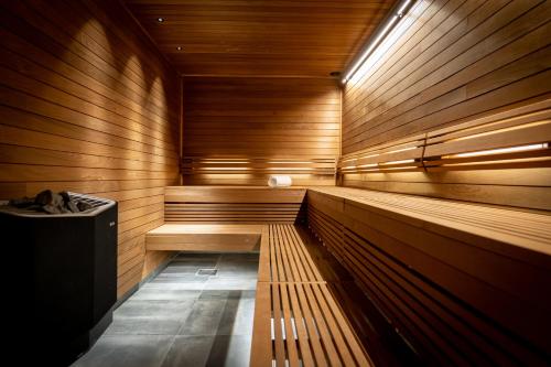 a sauna with wooden walls and a wooden floor at ProfilHotels Calmar Stadshotell in Kalmar