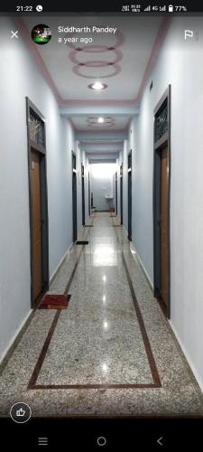 a hallway of a building with doors and a long corridor at Mahajan Palace and lodge in Naini