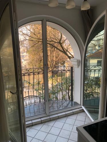 an open door to a balcony with a view at Villa Borak Sarajevo in Sarajevo