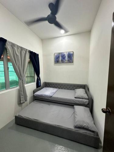 Ένα ή περισσότερα κρεβάτια σε δωμάτιο στο One Mama’s Guest House