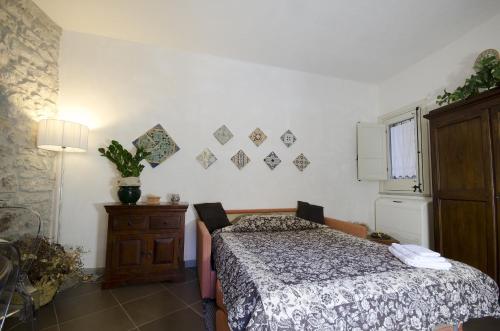 Ένα ή περισσότερα κρεβάτια σε δωμάτιο στο Residence Erice Pietre Antiche