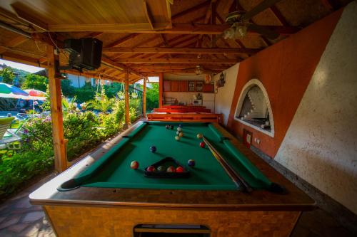 a pool table in an outdoor room with a pool table at Vila Livadeto in Troyan