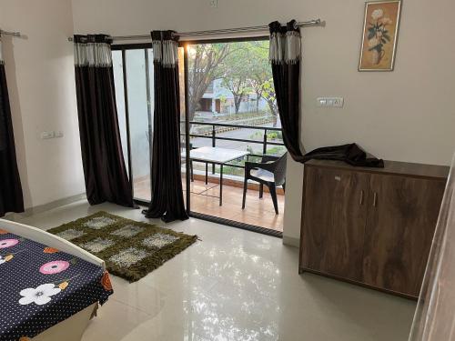 a living room with a view of a patio at Samruddhi S1 homestay villa swimming or S3,S20 in Nagpur