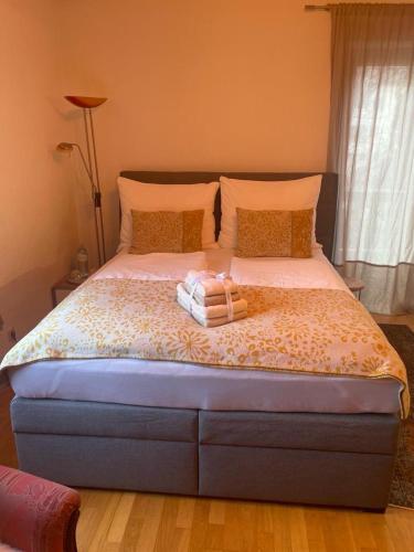 a bedroom with a bed with two pillows on it at Haus Karin Mallnitz in Mallnitz