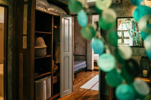 an open door into a room with a couch at Sand in My Shoes Beach Loft in Thong Nai Pan Noi