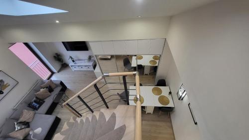 an overhead view of a living room and staircase in a house at Aparthotel Riva in Zawiercie