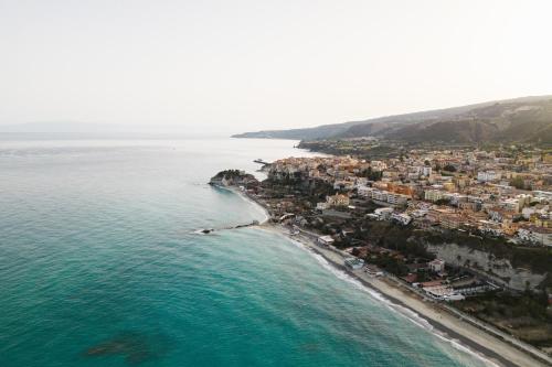 an aerial view of a beach and the ocean at Labranda Rocca Nettuno Tropea in Tropea