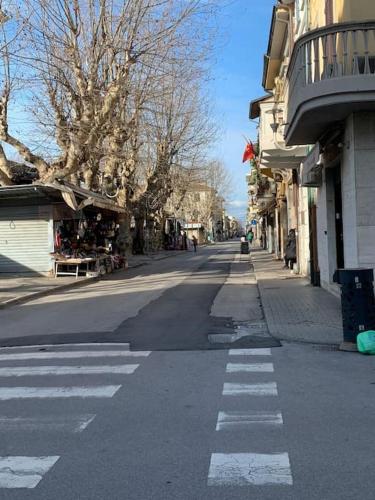 an empty street with a crosswalk in a city at Loft Carlotta in Viareggio
