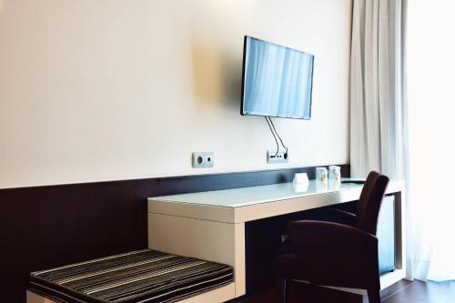TV a/nebo společenská místnost v ubytování Hotel Alda Carril