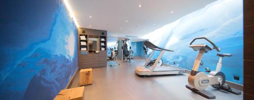 a gym with a large mural on the wall at Agora Swiss Night by Fassbind in Lausanne