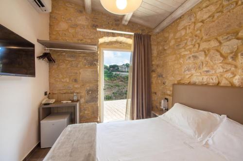 Ένα ή περισσότερα κρεβάτια σε δωμάτιο στο San Giorgio Palace Hotel Ragusa Ibla