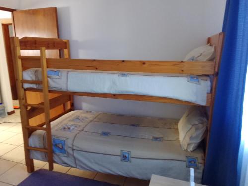 a couple of bunk beds in a room at Green Pastures in Great Brak River