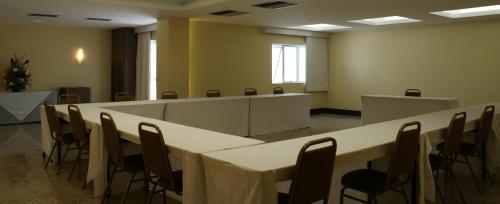 a conference room with a long table and chairs at Tropical Barra Hotel in Rio de Janeiro