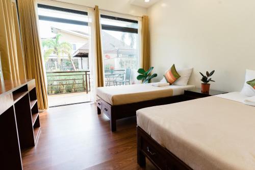 Ένα ή περισσότερα κρεβάτια σε δωμάτιο στο Asian Vanda Villas