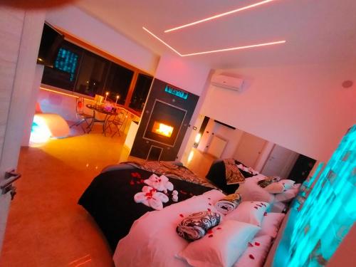 a bedroom with two beds with pillows at B&B GRECALE Suite & Spa in Rende