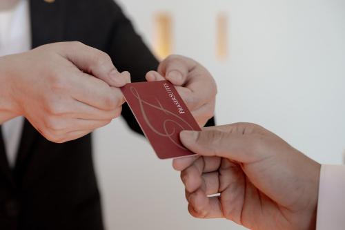 a man holding a piece of chocolate in his hands at Fraser Suites Al Liwan in Manama