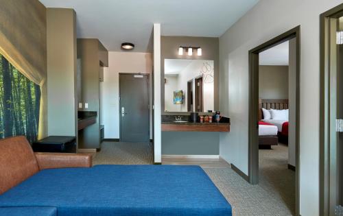 a hotel room with a bed and a bathroom at Great Wolf Lodge Georgia in La Grange