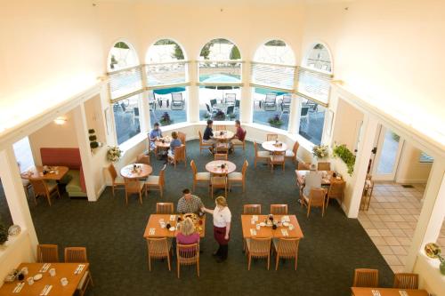 an overhead view of a restaurant with people sitting at tables at Gorges Grant Hotel in Ogunquit