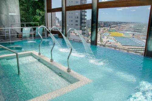a swimming pool on top of a building at HOTEL KONKE MAR DEL PLATA in Mar del Plata