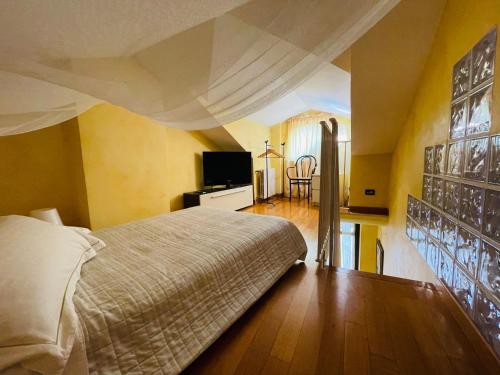 Postel nebo postele na pokoji v ubytování Casa Caroli, charme e comfort nel cuore di Alba
