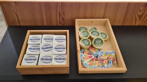 two wooden boxes filled with differentiatesiatesiatesiatesktop at Residence Altea in Ortisei