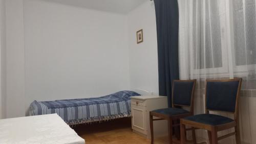 Ένα ή περισσότερα κρεβάτια σε δωμάτιο στο Apartamenty Warka