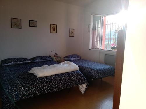 Säng eller sängar i ett rum på Poggio agli Ulivi