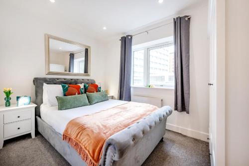 a bedroom with a large bed and a window at Welcome London - New Oxford Street in London