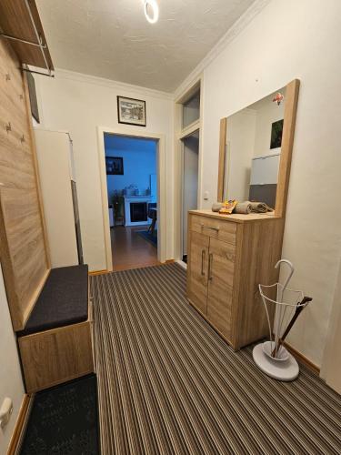 a bathroom with a vanity and a large mirror at Ferienwohnung - Apartment Pichlarn Holiday in Aigen im Ennstal