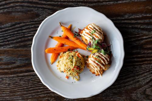 a plate of food with carrots on a table at Historic Summit Inn in Farmington