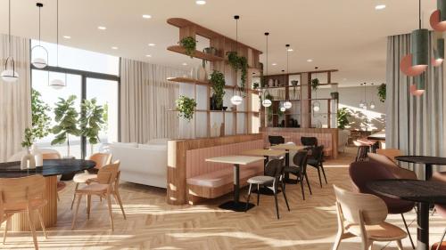 a rendering of a restaurant with tables and chairs at Residence Inn by Marriott Geneva City Nations in Geneva
