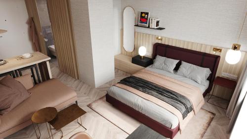 - une chambre avec un grand lit et un bureau dans l'établissement Residence Inn by Marriott Geneva City Nations, à Genève
