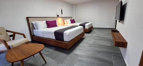 Postel nebo postele na pokoji v ubytování QUINTA SAN CLEMENTE