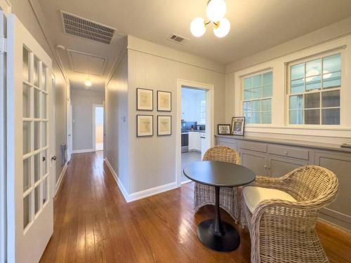 a kitchen with a table and chairs in a room at New Comfy Bungalow on Washington-Dedicated Office in Waco