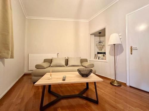 a living room with a couch and a coffee table at Central House in Plaka in Athens