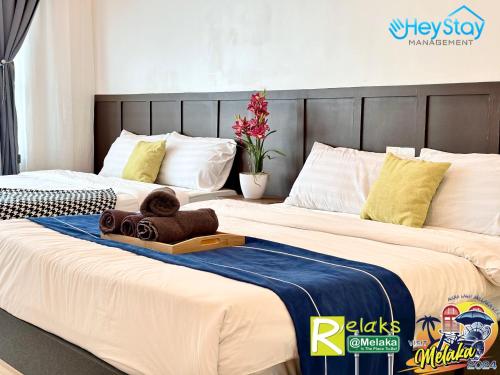 Postel nebo postele na pokoji v ubytování TheWave Residence By Heystay Management