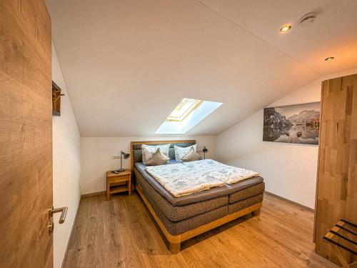 a bedroom with a bed in a attic at Ferienwohnungen Gastager Hof in Ruhpolding