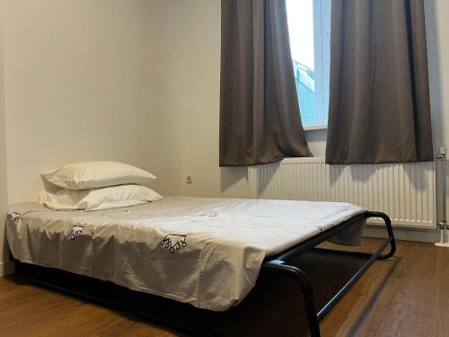 Un pat sau paturi într-o cameră la The Hague Heritage