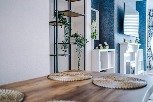 two plates on a wooden table in a room at The Retreat near Salford Quays in Manchester