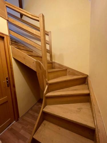 a set of wooden stairs in a room at Hotel King George in Prague