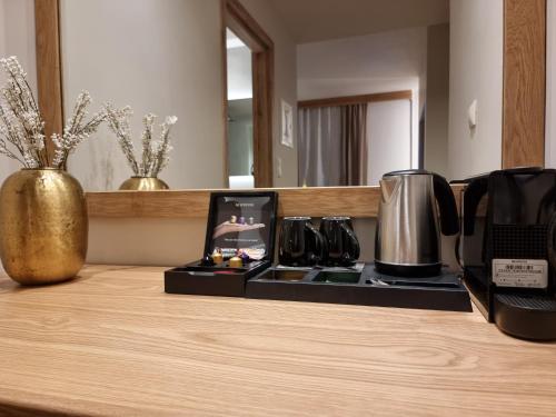 a counter top with a coffee maker on it at Likoria Hotel in Arachova