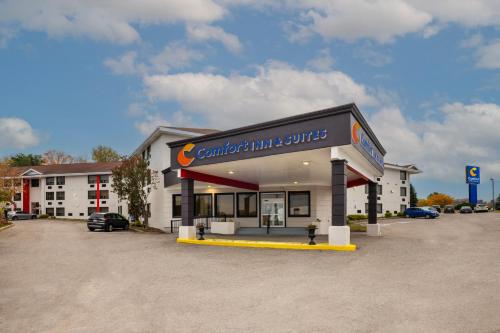 a car rental building with a car dealership at Comfort Inn & Suites in Barrie