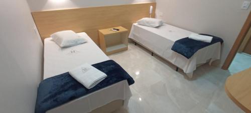Un pat sau paturi într-o cameră la Hotel New Space