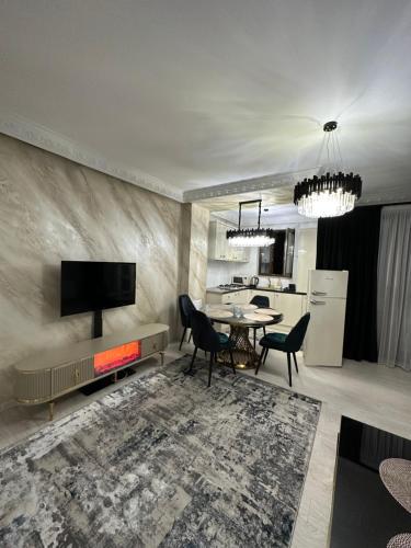TV a/nebo společenská místnost v ubytování Apartament Simoni