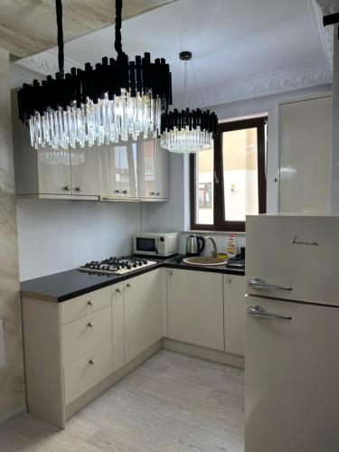 Kuchyň nebo kuchyňský kout v ubytování Apartament Simoni