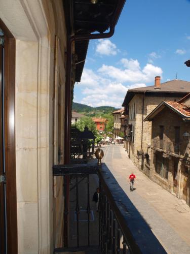a view of a street from a balcony at M&UGA Hotela in Elorrio