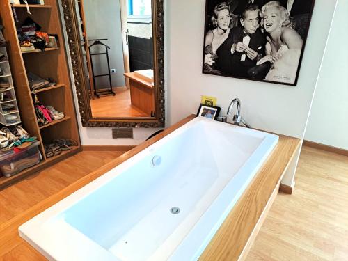 a bath tub in a bathroom with a mirror at Chalet Irlanda Luxury in Peñíscola