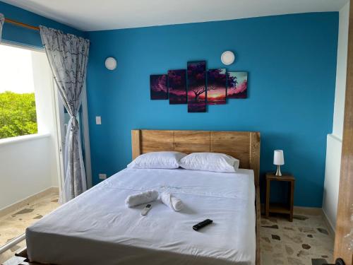 Ein Bett oder Betten in einem Zimmer der Unterkunft Hotel Isla Mágica