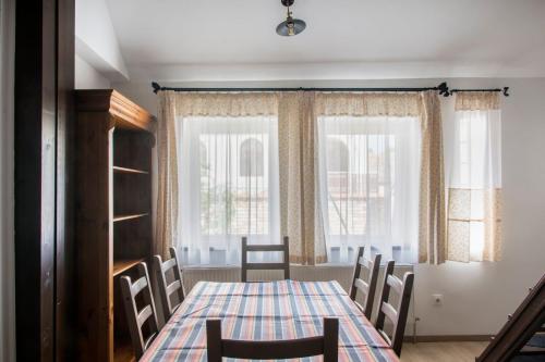 a dining room with a table and chairs at SáBa Vendégház in Tapolca